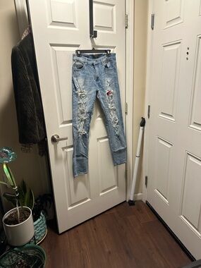 AMIRI Light Blue Distressed Boyfriend Jeans with Red Patch